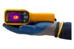 Fluke VT06 compact size comparison in electrician's hand